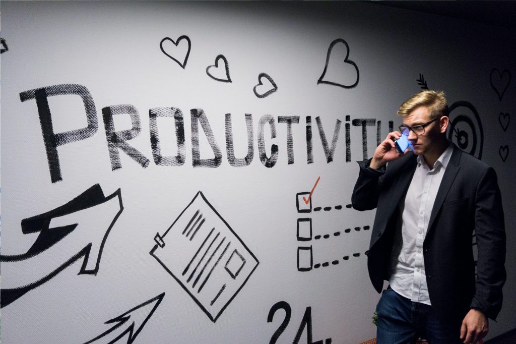 A man thinking about productivity written on the board.