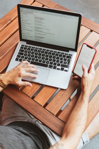 a person writing an email on the laptop.