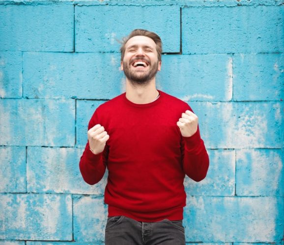 A person showing enthusiasm in his disposition